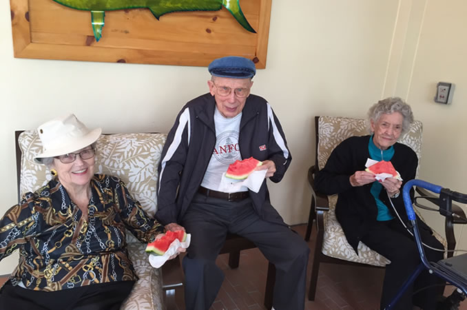 Resident holding a slice of watermelon